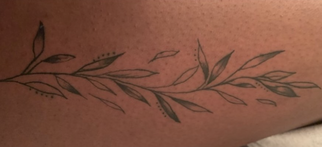 Delicate leaf branch tattoo