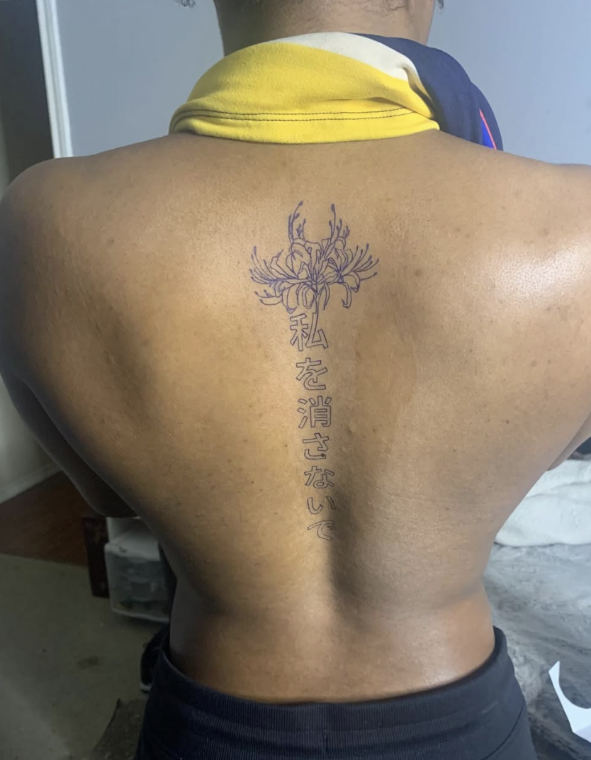 Spider lily with Japanese kanji spine tattoo